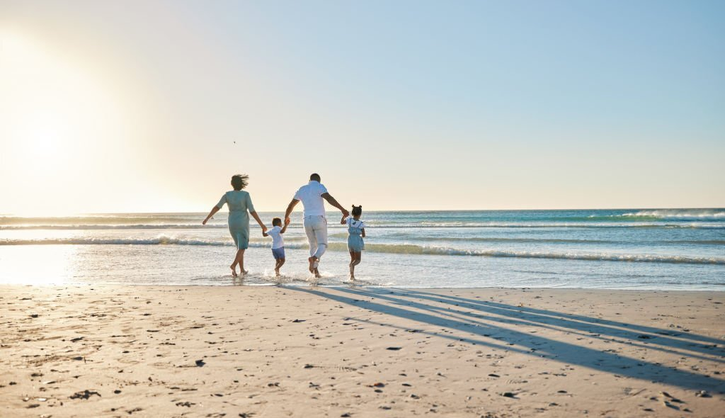 family on the beach, family trip