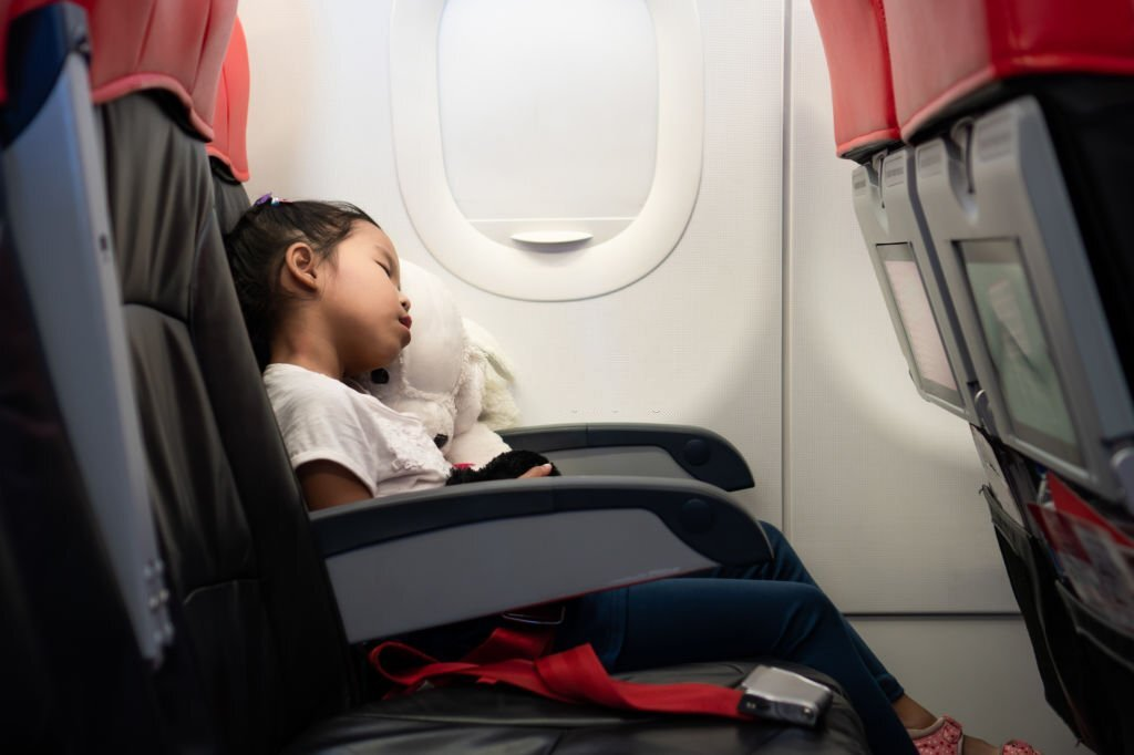 sleeping kid on the airplane