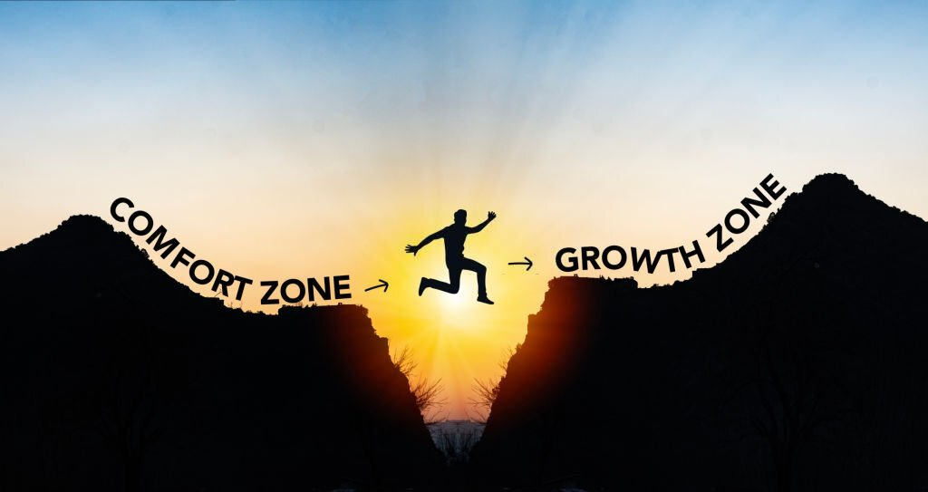 man jumping from comfort zone to growth zone