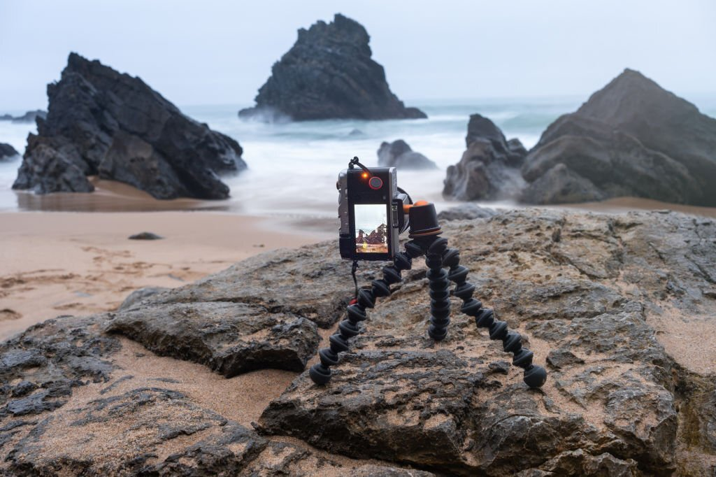 camera tripod stand, taking pictures on a beach