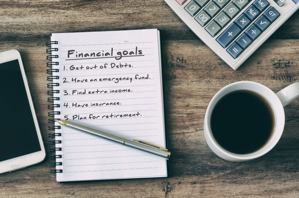 financial goals, notepad on a table