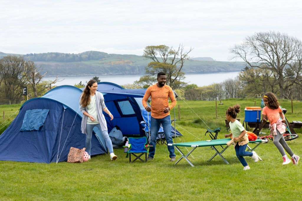family enjoying a camping trip, weekend camping