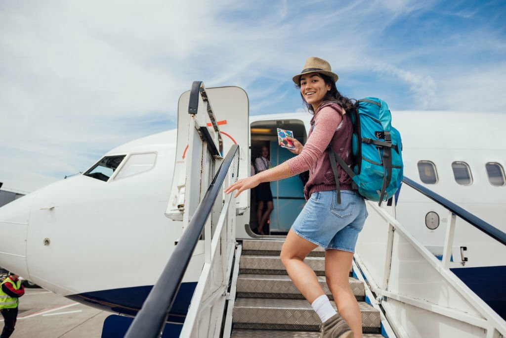 vacation trip, woman boarding a plane