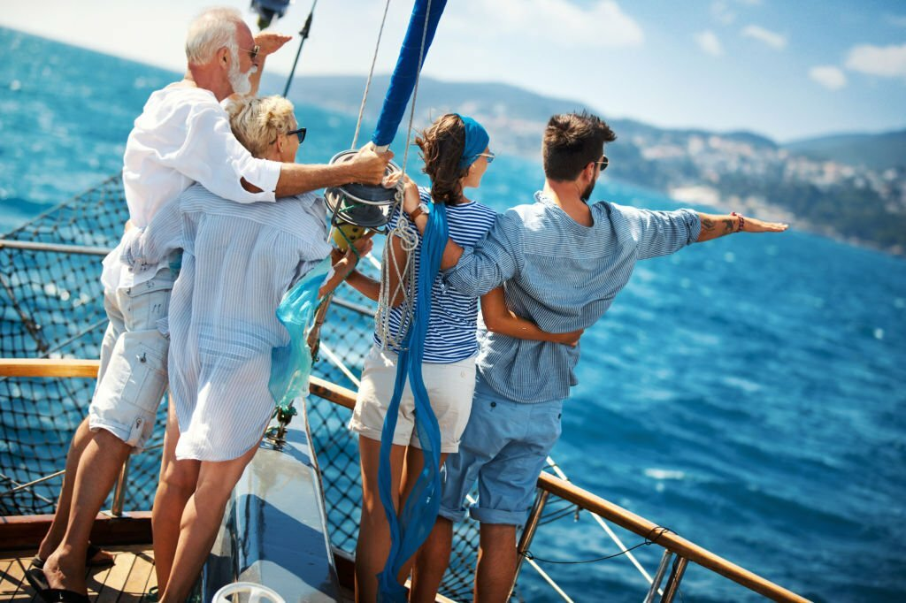 cruise vacations for families, family enjoying a sailing cruise during summer vacation