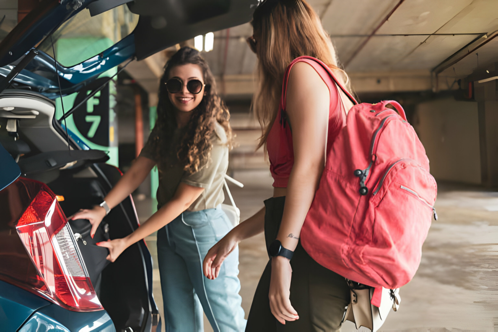 airport parking, girls placing luggage in their car