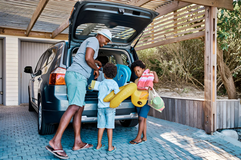 A family packing the car to leave for a summer trip, transportation expense