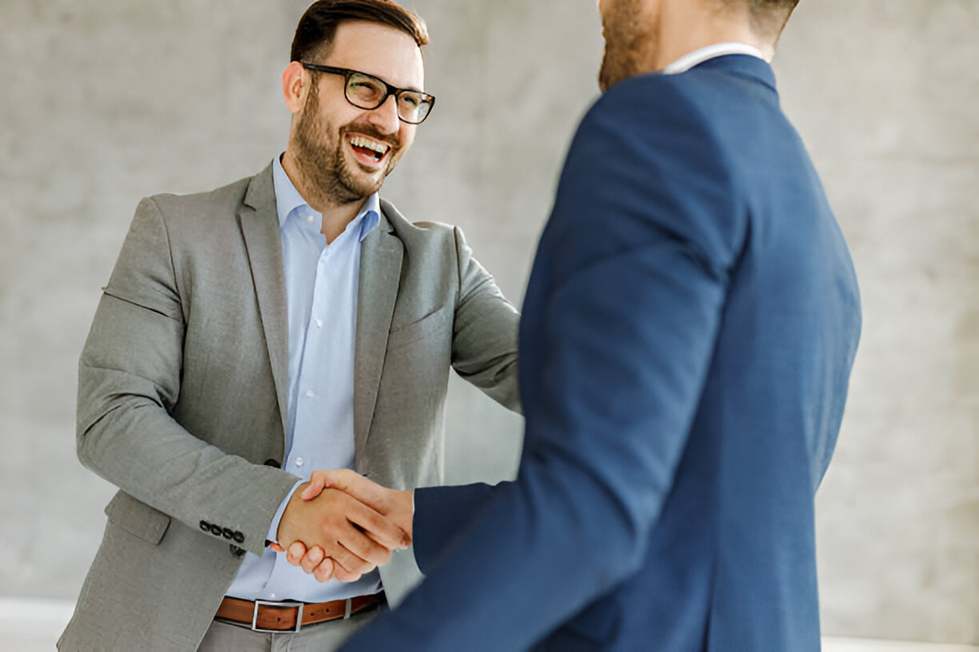 salesperson shaking hands with customer, amiable buyer, good customer service